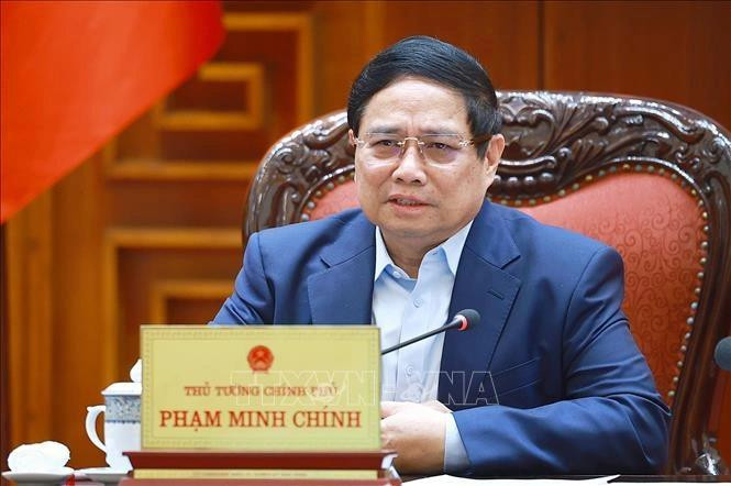 Thủ tướng Phạm Minh Chính chủ trì cuộc họp với các bộ, ngành sau khi Hoa Kỳ tuyên bố mức áp thuế mới (Ảnh: Dương Giang – TTXVN)
