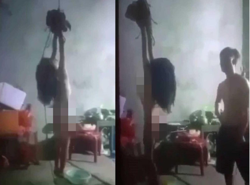 Người đàn ông dùng cây roi nhỏ đánh bé gái Người đàn ông dùng cây roi nhỏ đánh bé gái