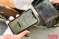 [ẢNH] Kiểm tra mã QR ở chốt ra vào vùng đỏ Hà Nội: Không ùn tắc, giấy đi đường cũ được lưu thông