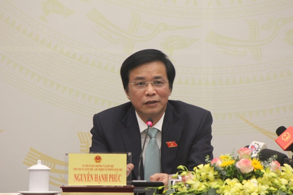 Ông Nguyễn Hạnh Phúc trả lời câu hỏi của báo chí tại buổi họp báo