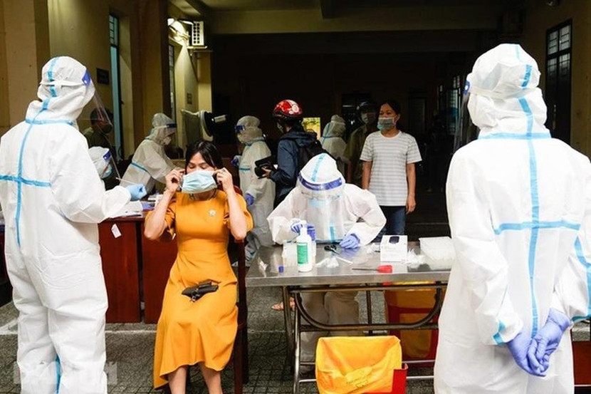 Lấy mẫu xét nghiệm Covid-19 tại một khu vực ổ dịch (Ảnh minh họa) Lấy mẫu xét nghiệm Covid-19 tại một khu vực ổ dịch (Ảnh minh họa)