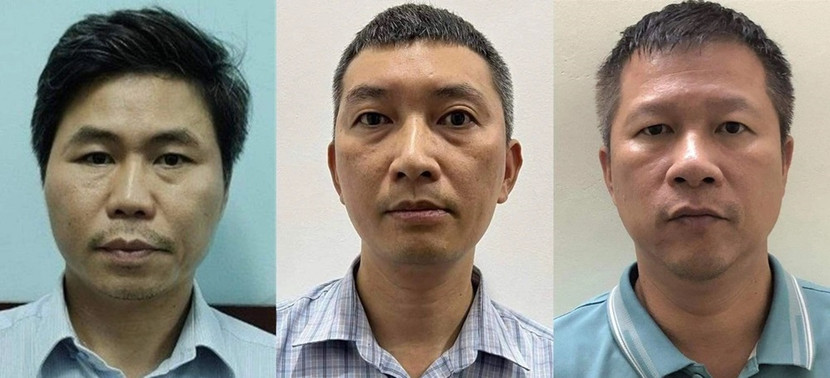 Bị can Trần Quốc Hùng (ngoài cùng, bên trái) cùng hai bị can liên quan