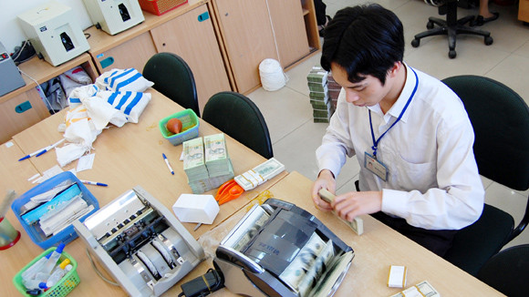 Ngân hàng Nhà nước điều chỉnh tăng tỷ giá tăng 1% ảnh 1