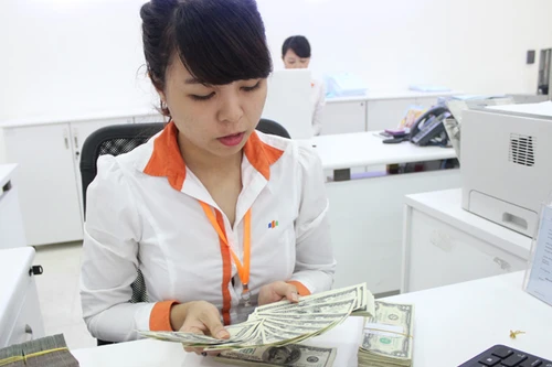 Thị trường bình tĩnh đón nhận cơ chế điều hành tỷ giá lên-xuống hàng ngày