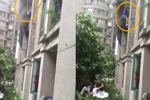 Khoảnh khắc kinh hoàng bố ném con khỏi căn nhà đang cháy