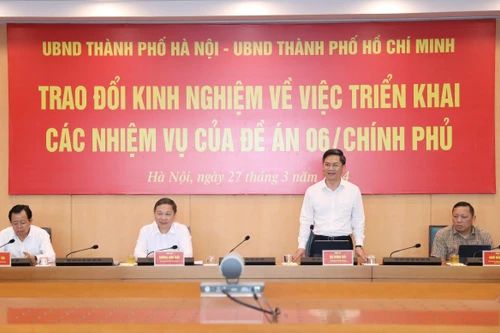 Hà Nội và TP Hồ Chí Minh trao đổi kinh nghiệm để "cùng đi nhanh hơn" trong thực hiện Đề án 06 của Chính phủ