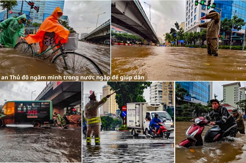 Hình ảnh chiến sỹ Công an Thủ đô ngâm mình trong nước ngập để giúp dân