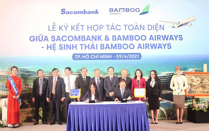 Bà Nguyễn Đức Thạch Diễm – thành viên HĐQT kiêm Tổng giám đốc Sacombank cùng ông Đặng Tất Thắng –Tổng giám đốc Bamboo Airways ký kết thỏa thuận hợp tác dưới sự chứng kiến của lãnh đạo hai bên Bà Nguyễn Đức Thạch Diễm – thành viên HĐQT kiêm Tổng giám đốc Sacombank cùng ông Đặng Tất Thắng –Tổng giám đốc Bamboo Airways ký kết thỏa thuận hợp tác dưới sự chứng kiến của lãnh đạo hai bên