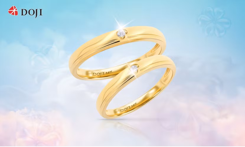 Mẫu nhẫn cưới với thiết kế tối giản, điểm xuyết cùng 1 viên kim cương tự nhiên không kém phần nổi bật.