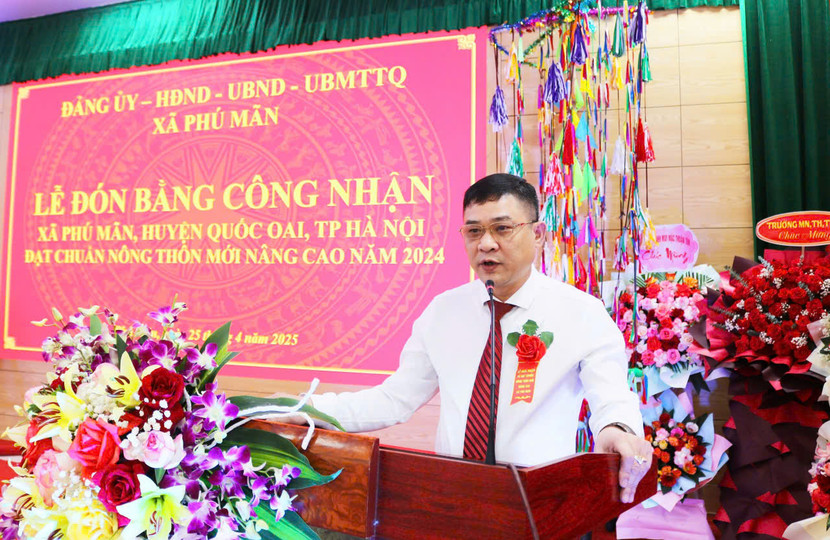 Ông Đinh Ngọc Sơn – Chủ tịch UBND xã Phú Mãn báo cáo thành tích đạt chuẩn nông thôn mới nâng cao 2024