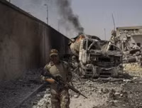 Ám ảnh nữ khủng bố ôm con nhỏ để đánh bom tự sát giết binh sĩ quân đội Iraq