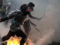 Cảnh sát Hồng Kông lý giải việc lần đầu tiên nổ súng và phun vòi rồng để ứng phó với biểu tình