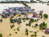 [Ảnh] Chưa hết đợt dịch Covid-19 thứ hai, Trung Quốc lại ứng phó với lũ lụt lịch sử
