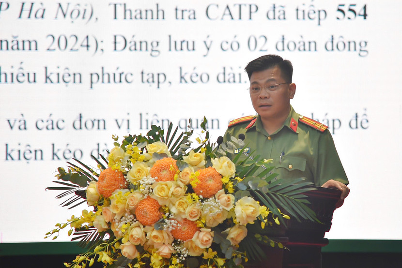 Thượng tá Phạm Đăng Khôi – Chánh Thanh tra CATP Hà Nội báo cáo tại hội nghị