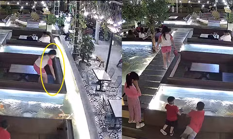 Hình ảnh bé gái sang nhặt ví mang về bàn ngồi chung với người đàn ông Hình ảnh bé gái sang nhặt ví mang về bàn ngồi chung với người đàn ông