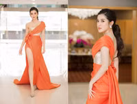 Diện váy xẻ cao ngút Huyền My cẩn thận che chắn tránh sự cố