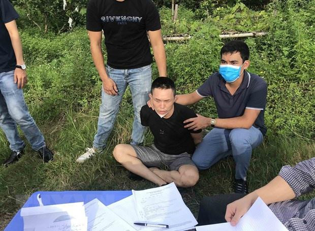 Phan Trần Chiêu bị bắt giữ. Ảnh: TTXVN Phan Trần Chiêu bị bắt giữ. Ảnh: TTXVN