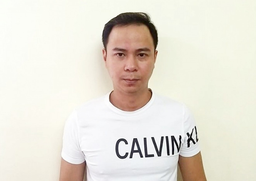 Đối tượng Nguyễn Tiến Hưng tại cơ quan công an. Ảnh: Công an cung cấp