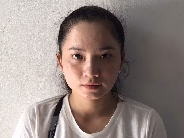 Đối tượng Nguyễn Thị Việt Trinh tại cơ quan công an. Ảnh: TTXVN