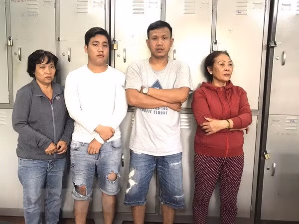 Bốn đối tượng bị lực lượng công bắt giữ gồm Lan, Sang, Tâm và Lập. Ảnh: TTXVN