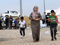 [ẢNH]: Đau lòng cuộc sống bấp bênh của các em nhỏ trong cuộc chiến ở đông bắc Syria