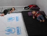 [ẢNH]: Đau lòng cuộc sống bấp bênh của các em nhỏ trong cuộc chiến ở đông bắc Syria