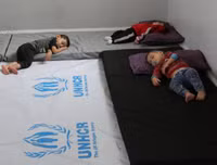 [ẢNH]: Đau lòng cuộc sống bấp bênh của các em nhỏ trong cuộc chiến ở đông bắc Syria
