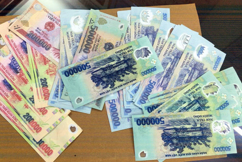 Không biết mình đang sử dụng tiền giả có bị xử lý hình sự? ảnh 2