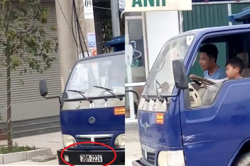 Phẫn nộ cảnh người đàn ông để bé trai cầm lái xe tải chạy trên đường ảnh 1