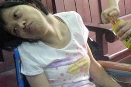 Cô gái ngồi xe lăn thắng kiện