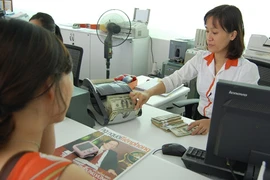 Không phá giá tiền đồng Việt Nam