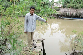 Giận chồng nói nhảm, vợ ném con gái 31 ngày tuổi xuống sông