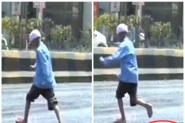 Nắng nóng khiến đường Ấn Độ chảy nhựa, người dân "mất dép" khi đi lại