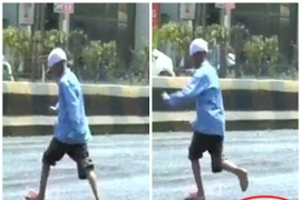 Nắng nóng khiến đường Ấn Độ chảy nhựa, người dân "mất dép" khi đi lại