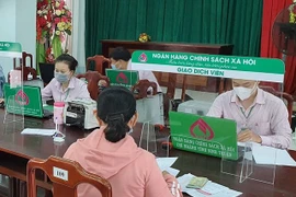 Từ 1/12, giảm lãi suất cho vay hộ nghèo và các chương trình tín dụng chính sách