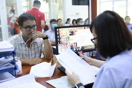 Hà Nội đề xuất hỗ trợ 1,5 lần tiền lương hiện hưởng/tháng cho cán bộ làm chuyển đổi số