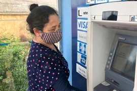 Hà Nội: Chi trả lương hưu tháng 8 cho người hưởng mới qua tài khoản ATM