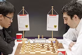 Lê Quang Liêm cầm hòa cựu vô địch thế giới 