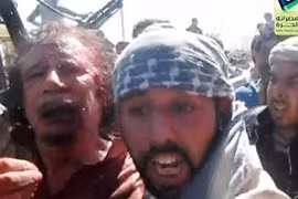 Gaddafi nói gì khi bị kéo lê trên đường