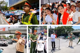 Chiến sỹ CATP Hà Nội đội nắng mưa đảm bảo an toàn, trật tự cho người dân xem hợp luyện diễu binh