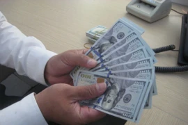 Tỷ giá đồng/USD bất ngờ tụt giảm sau khi FED tăng lãi suất