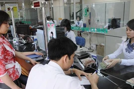 Cơ cấu lại hệ thống các tổ chức tín dụng gắn với xử lý nợ xấu 