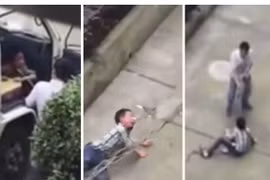 Phẫn nộ người cha Trung Quốc xích cổ con, kéo lê trên mặt đất