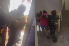 Bé sơ sinh cùng mẹ được lính cứu hỏa Công an Hà Nội hướng dẫn thoát khỏi đám cháy căn chung cư tầng 26