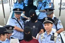 Trung Quốc áp giải về nước 129 kẻ lừa đảo viễn thông