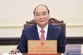 Chủ tịch nước Nguyễn Xuân Phúc điện đàm với Tổng thống Romania Klaus Werner Iohannis 