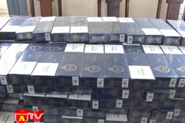 Dùng xe máy vận chuyển thuốc lá ngoại nhập lậu