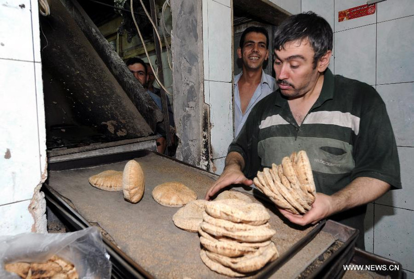 Dân Syria sống bình thản, bất chấp chiến tranh cận kề ảnh 1