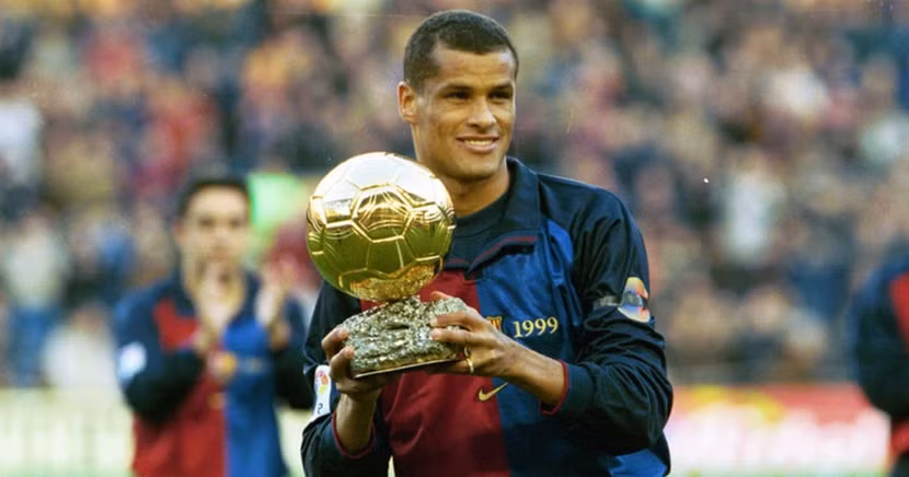 6 - Rivaldo. Năm 1999, Rivaldo đạt đỉnh cao với Quả bóng Vàng nhờ màn trình diễn rực sáng cùng Barca và đội tuyển Brazil. Ba năm sau, huyền thoại này ghi 5 bàn tại World Cup 2002, góp công lớn giúp Brazil lần thứ năm vô địch thế giới. Mùa 2002/2003, Rivaldo bổ sung nốt Champions League vào bộ sưu tập cùng AC Milan. nohu90. 6 - Rivaldo. Năm 1999, Rivaldo đạt đỉnh cao với Quả bóng Vàng nhờ màn trình diễn rực sáng cùng Barca và đội tuyển Brazil. Ba năm sau, huyền thoại này ghi 5 bàn tại World Cup 2002, góp công lớn giúp Brazil lần thứ năm vô địch thế giới. Mùa 2002/2003, Rivaldo bổ sung nốt Champions League vào bộ sưu tập cùng AC Milan. nohu90.