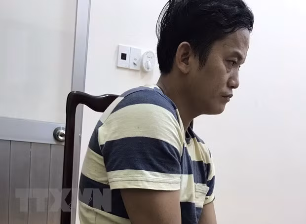 Tài xế Nguyễn Đắc An tại cơ quan công an. Ảnh: TTXVN